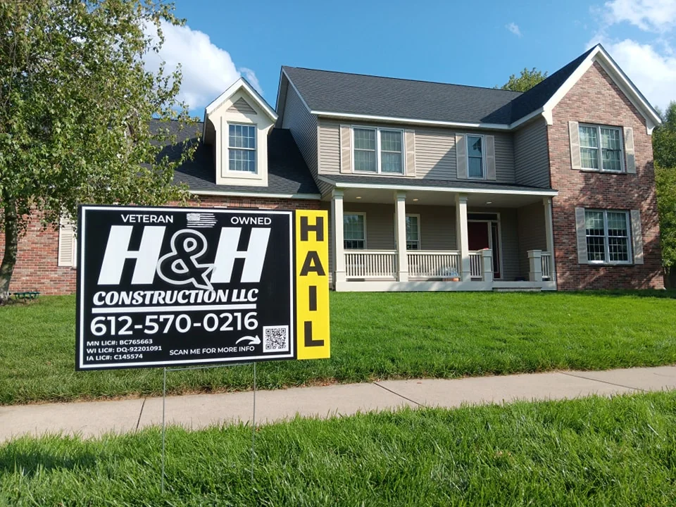 Finished home exterior with contractor sign